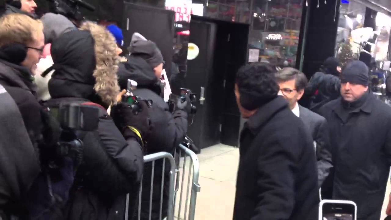 Anchor George Stephanopoulos giving a fist bump while leaving GMA studio in New York