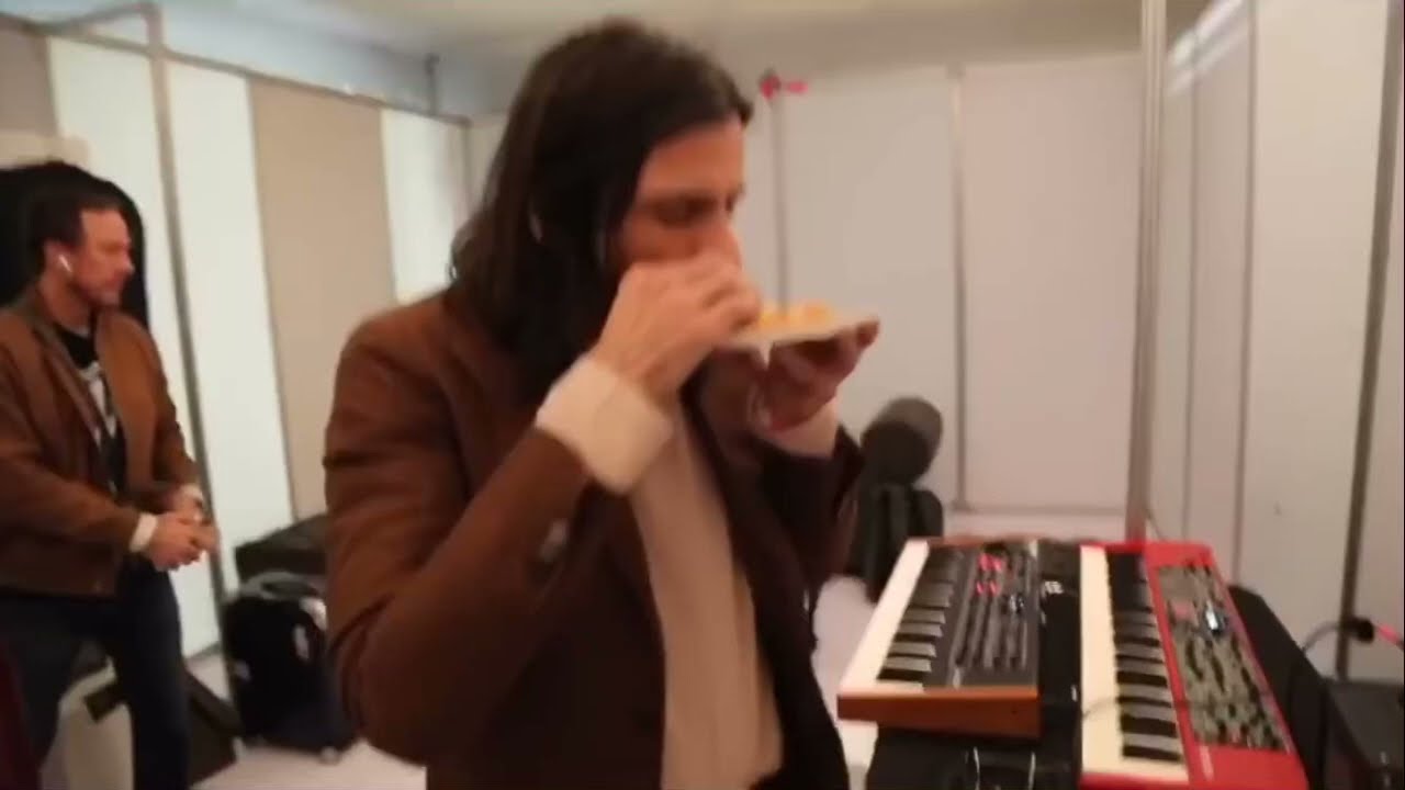 brian bell of weezer chokes on a piece of toast
