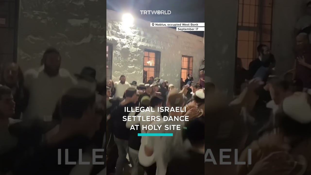 Israeli settlers dance at holy site in occupied West Bank